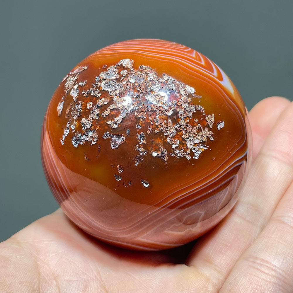 Vibrant Banded Carnelian Sphere with Stunning "Eye" Formation