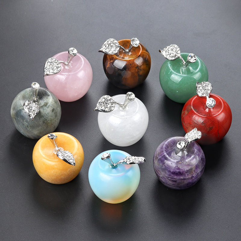 A collection of nine assorted gemstone apple figurines with sparkling silver-tone leaves