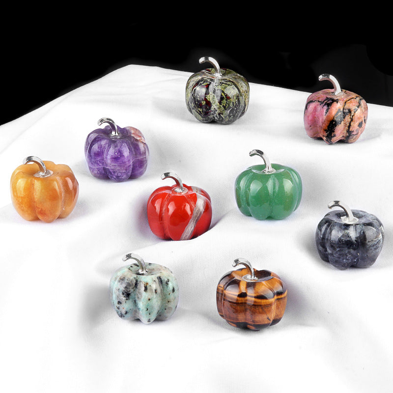 A collection of nine assorted gemstone pumpkins for fall and Halloween decor