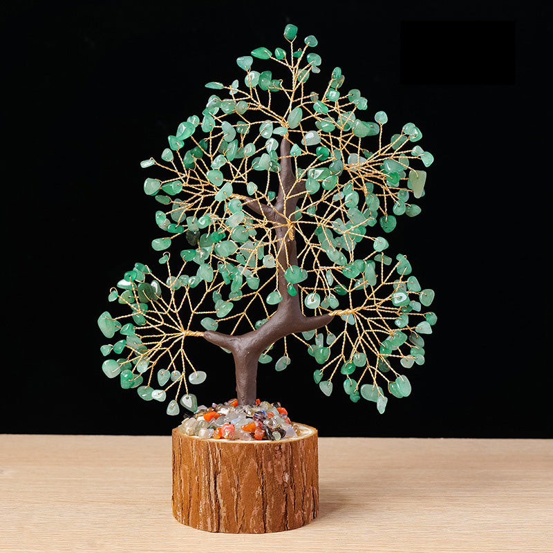 A feng shui money tree made with green aventurine crystal chips and gold wire