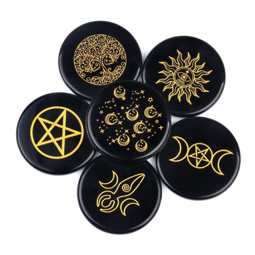 Set of black buttons with gold celestial symbols on a white background
