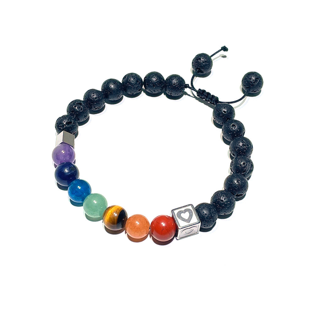 A 7 chakra lava stone bracelet with an adjustable macrame sliding knot clasp.