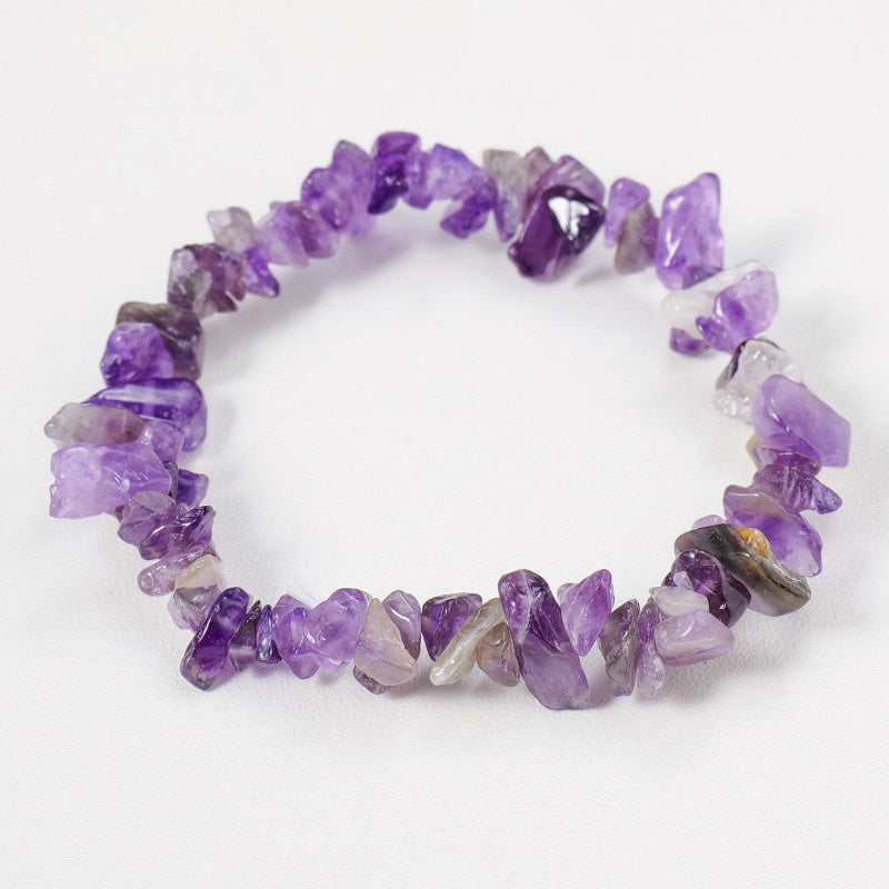 A stretchy bracelet made of deep purple raw amethyst crystal chips