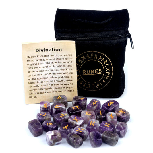 A complete amethyst crystal rune set with 25 tumbled stones, a black velvet pouch, and a guide card