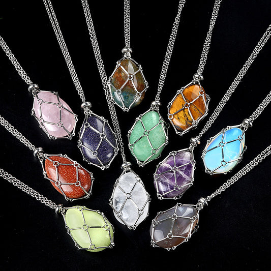 A collection of assorted crystal egg pendant necklaces, including Rose Quartz, Amethyst, and Tiger's Eye