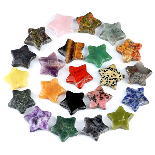 A circular arrangement of over 20 assorted polished crystal stars on a white background