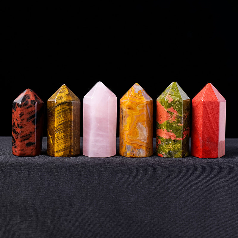 A lineup of six mini crystal points including tiger's eye and rose quartz