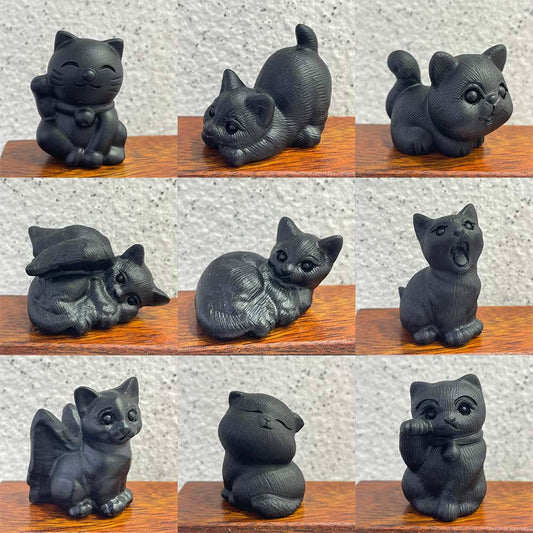 A grid showing nine different poses of hand-carved black obsidian cat figurines