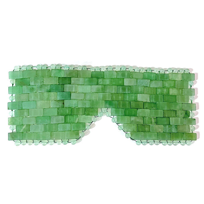 A green aventurine cooling eye mask with a brick-like woven pattern.