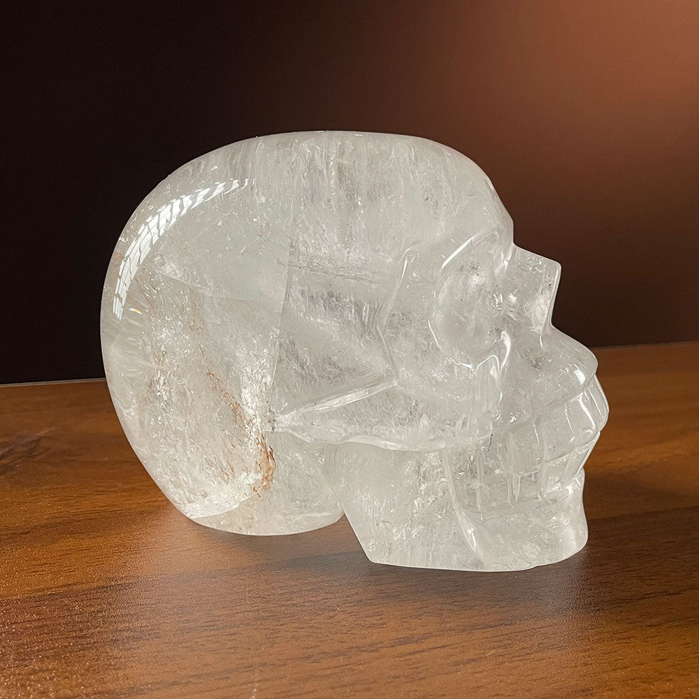 Side profile of a large 1.68kg hand-carved clear quartz crystal skull with high transparency