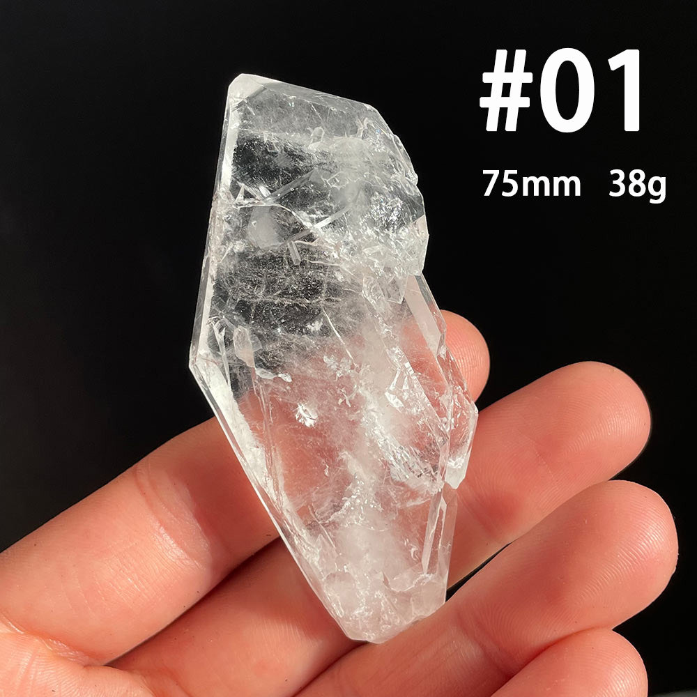 Clear tabular Faden Quartz crystal from Pakistan held in hand showing size and clarity