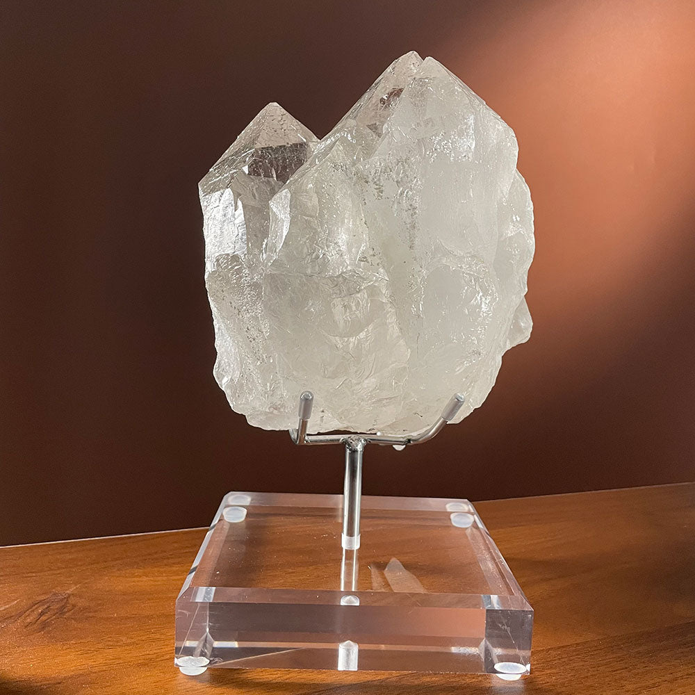 A monumental 3.79kg water-clear natural Himalayan quartz cluster from Pakistan resting on a clear acrylic display stand.
