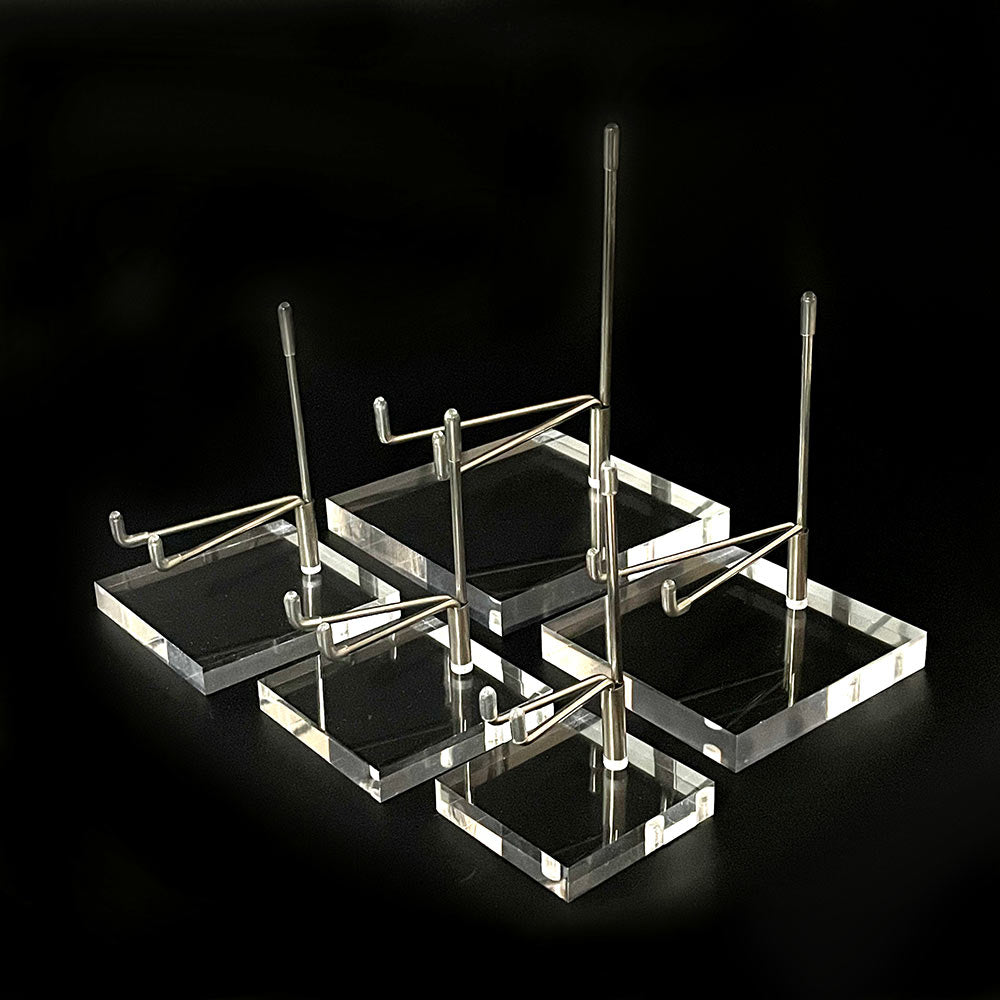 A group of five premium mineral display stands with clear acrylic bases and metal arms