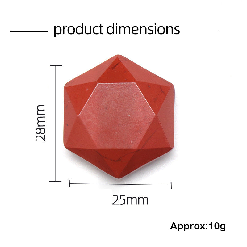 A red jasper faceted hexagon showing its dimensions of 28mm by 25mm