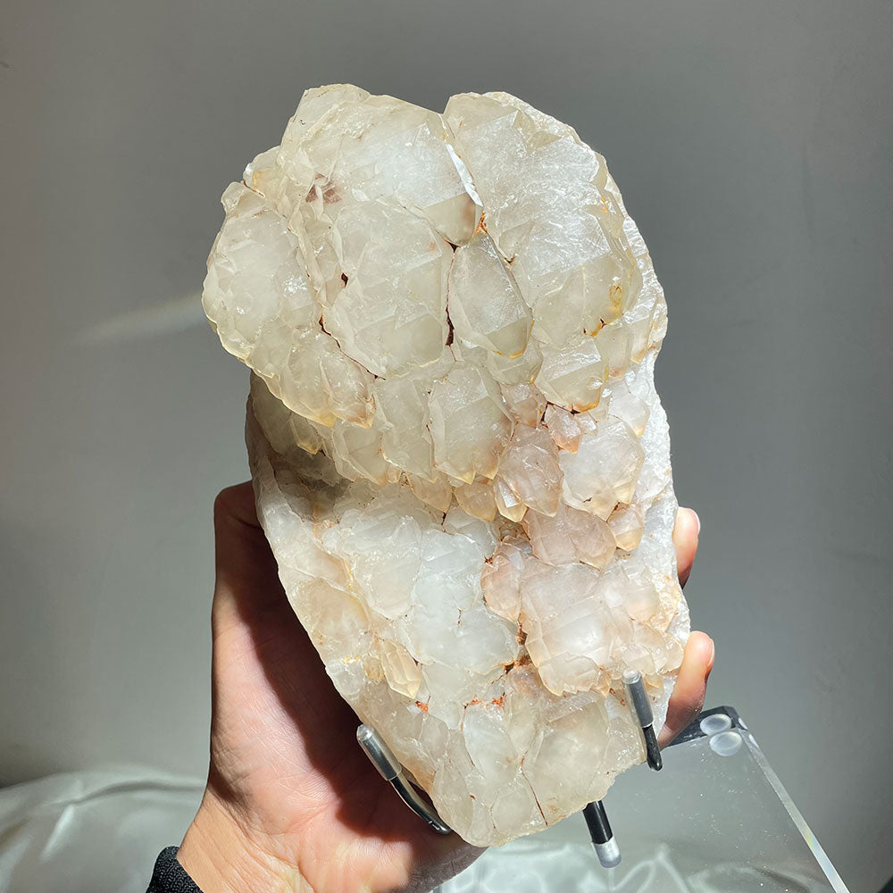 Hand holding a heavy 2.6kg raw Elestial Quartz showing complex skeletal geometric layers