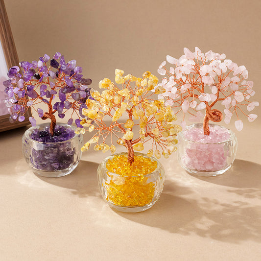 Three handmade crystal trees in amethyst, citrine, and rose quartz displayed together