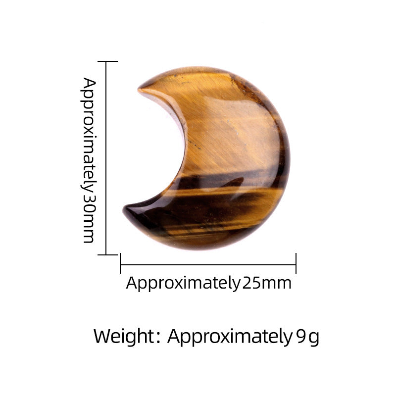 A polished tiger's eye crystal crescent moon showing dimensions of approximately 30mm by 25mm.